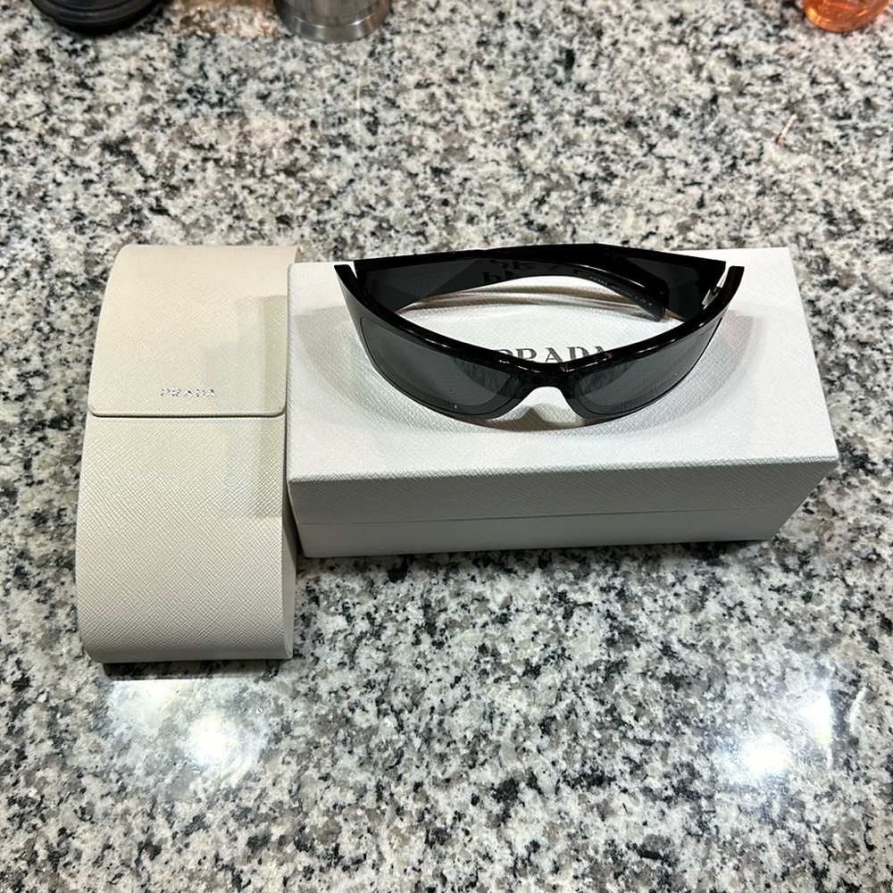 Brand new Prada shades from sunglasses hut never worn before !